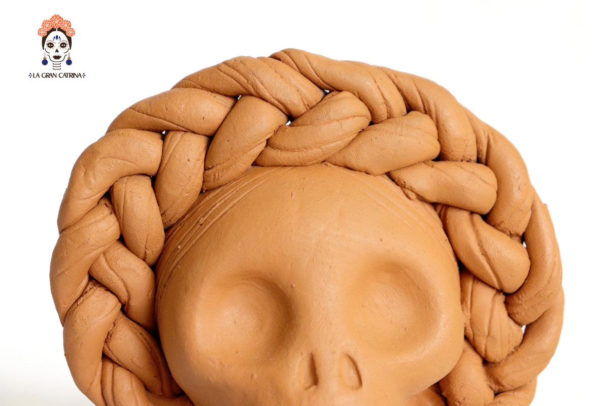 Maceta de calaveras pequeña naranja de chongo Maceta